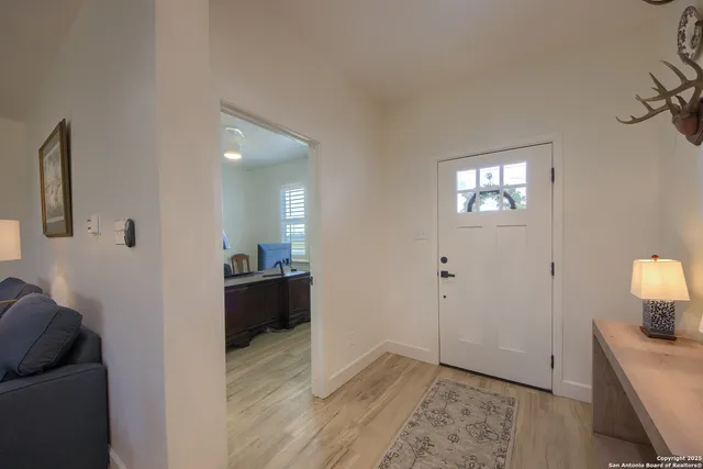 a view of a kitchen from the hallway