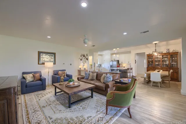 a living room with furniture and a table