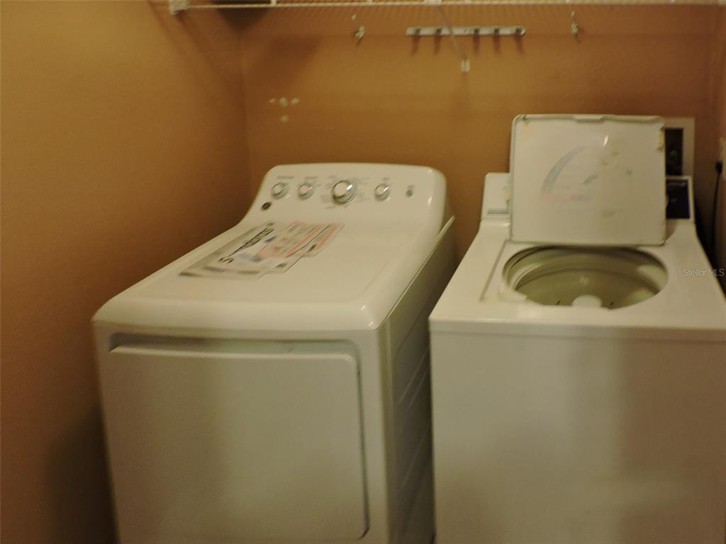 621 Dory Lane, Unit 103 Altamonte Springs, FL 32714 - Photo 11 of 13 a utility room with dryer and washer