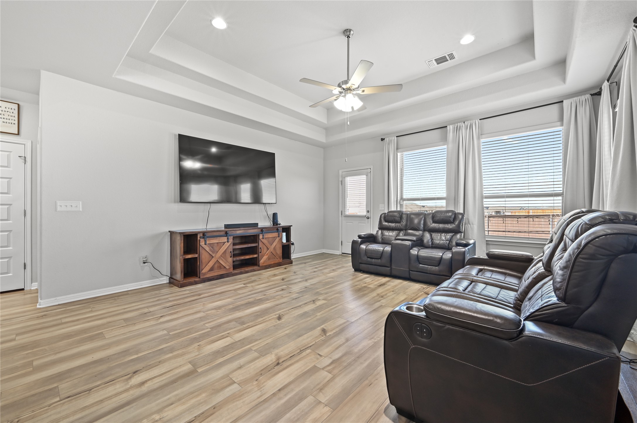 207 Dogvane Circle Kyle, TX 78640 - Photo 12 of 32 Living area featuring light wood-type flooring, ceiling fan, and recessed lighting