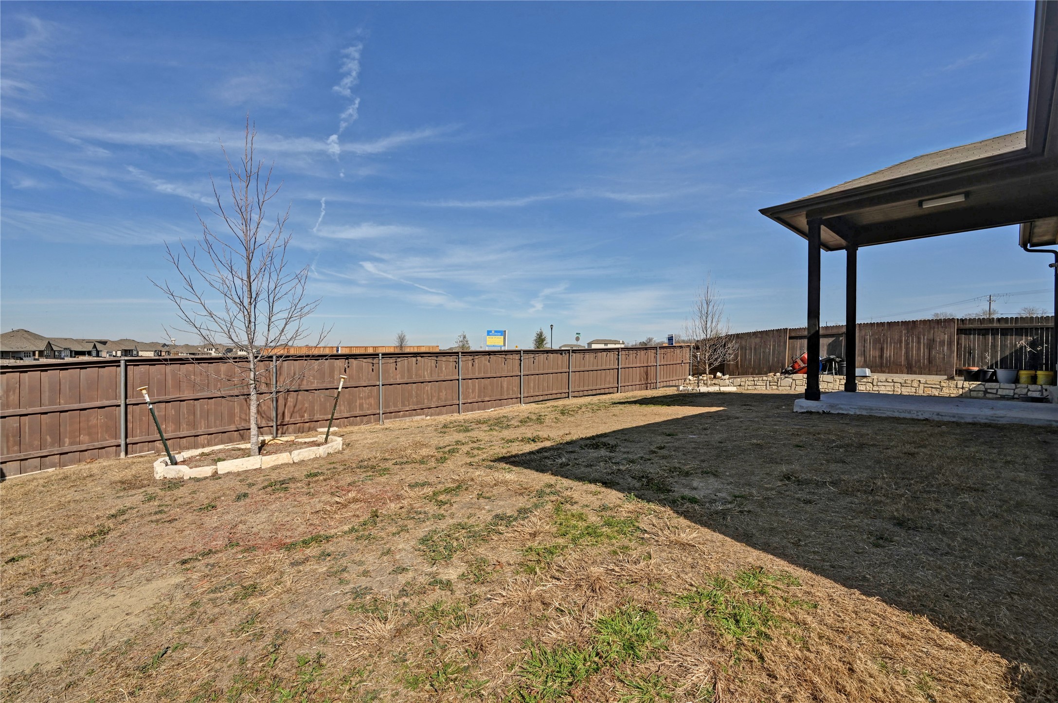 207 Dogvane Circle Kyle, TX 78640 - Photo 32 of 32 Fenced backyard with a patio