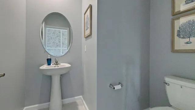 a room with a sink and a mirror