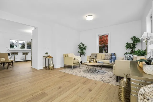 a living room with furniture and a table