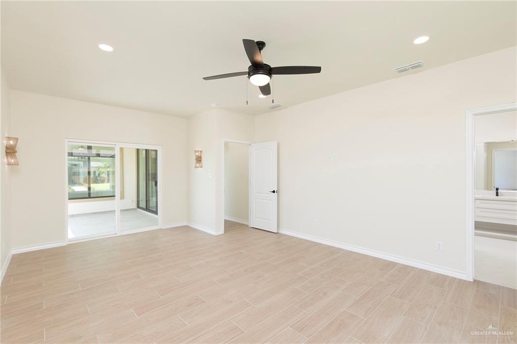 8030 North 50th Street McAllen, TX 78504 - Photo 10 of 23 Empty room with recessed lighting, a ceiling fan, and light wood-style flooring