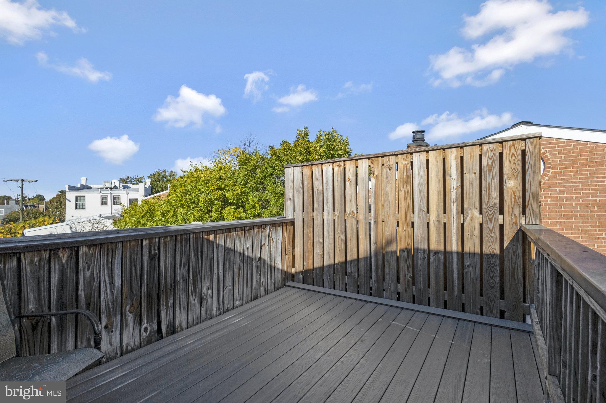 116 Commerce Street Alexandria, VA 22314 - Photo 26 of 50 Sunny rooftop retreat with wooden deck.