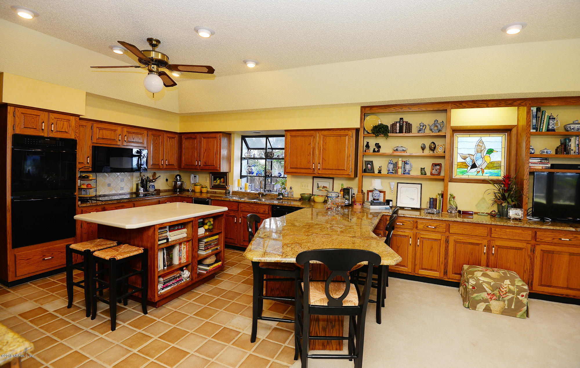 2963 Front Road Jacksonville, FL 32257 - Photo 20 of 63 a large kitchen with stainless steel appliances granite countertop a stove a sink dishwasher and a dining table with the kitchen view