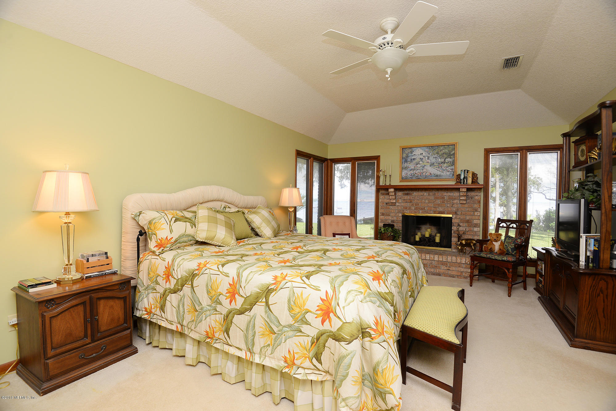 2963 Front Road Jacksonville, FL 32257 - Photo 25 of 63 a spacious bedroom with a bed and a couch