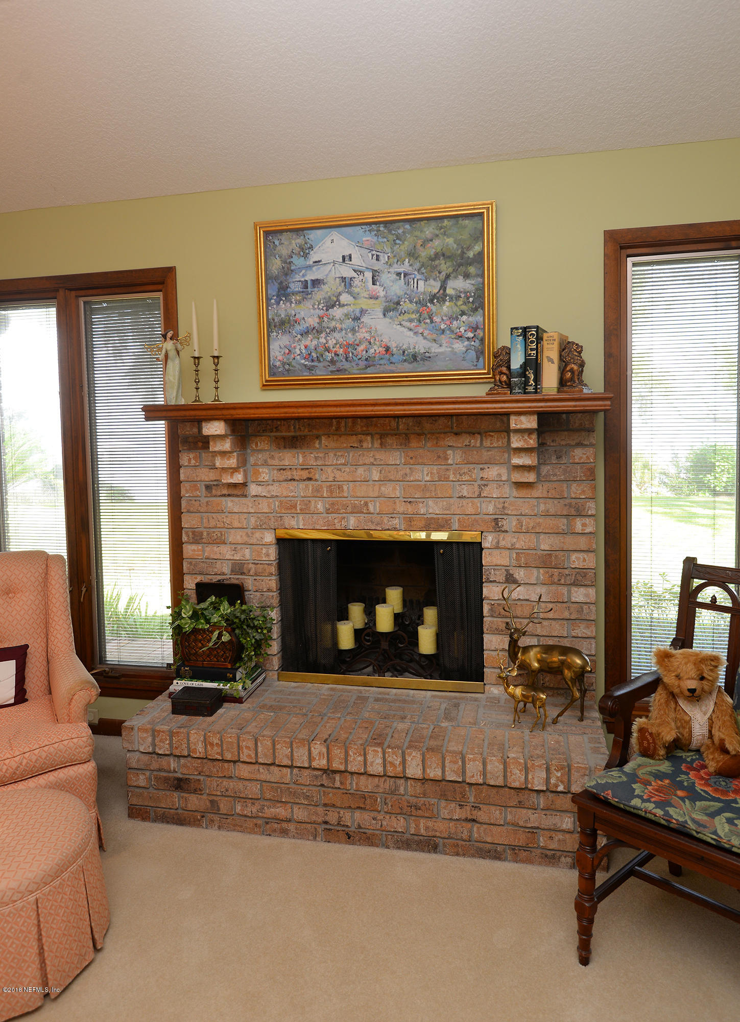 2963 Front Road Jacksonville, FL 32257 - Photo 27 of 63 a living room with furniture and a fireplace