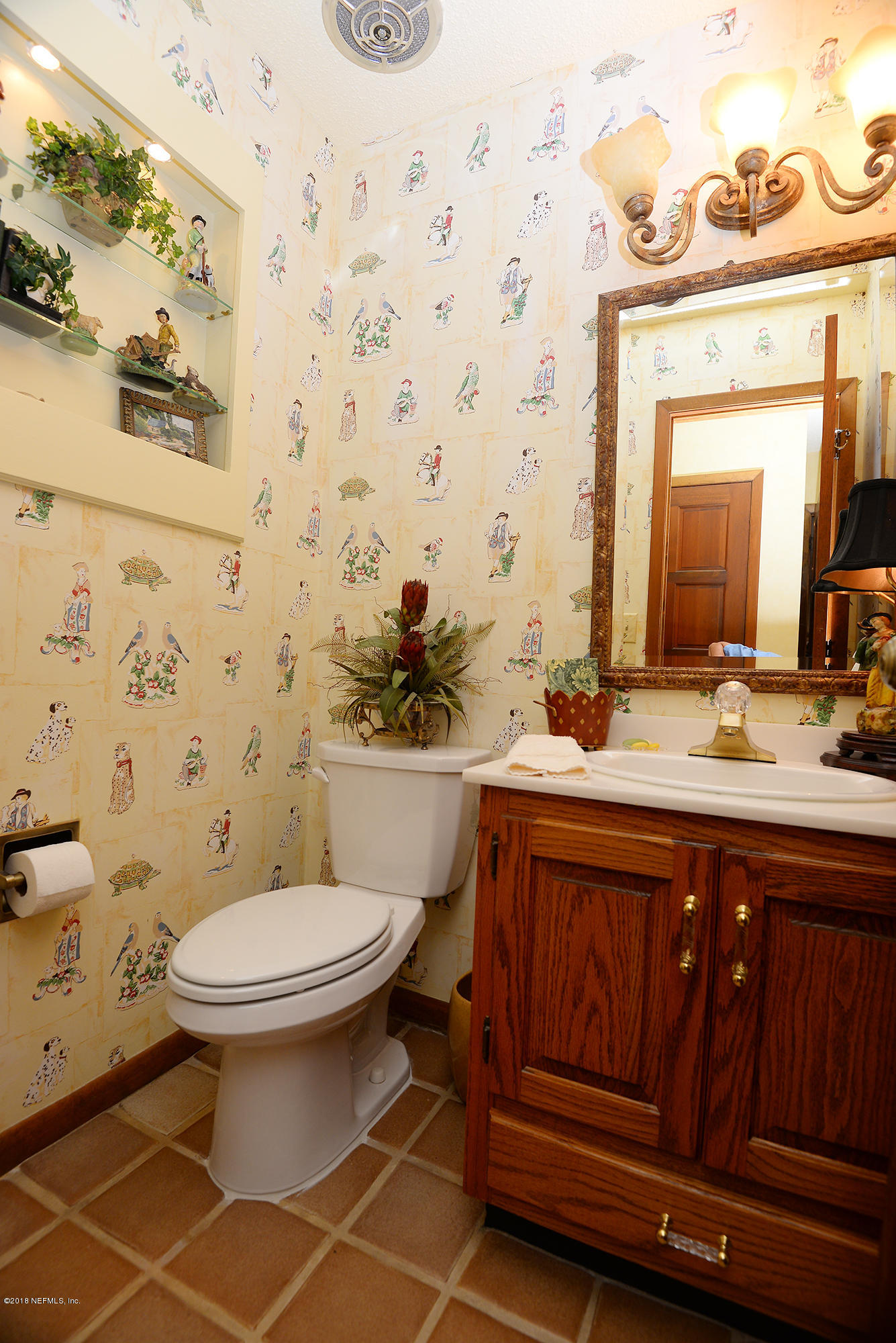 2963 Front Road Jacksonville, FL 32257 - Photo 41 of 63 a bathroom with a sink mirror vanity and toilet
