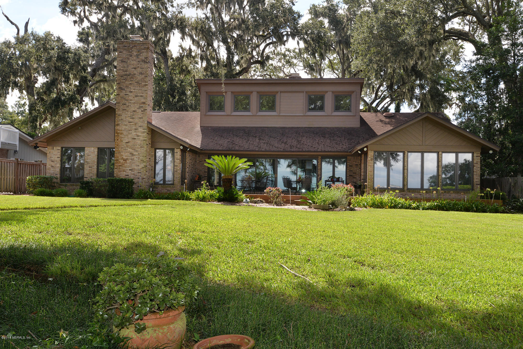 2963 Front Road Jacksonville, FL 32257 - Photo 48 of 63 a front view of a house with yard and green space