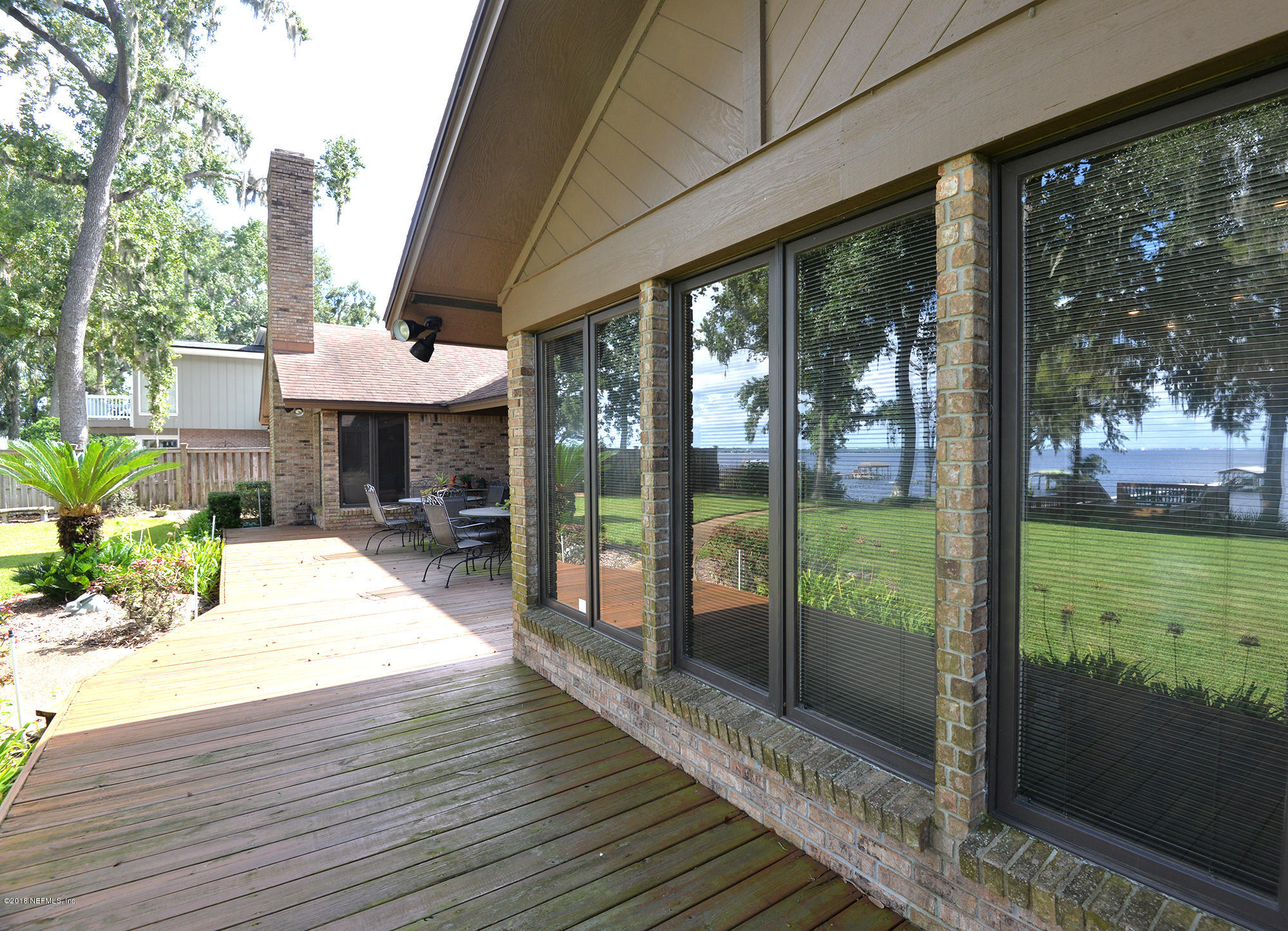 2963 Front Road Jacksonville, FL 32257 - Photo 50 of 63 a porch with seating space and hardwood floor