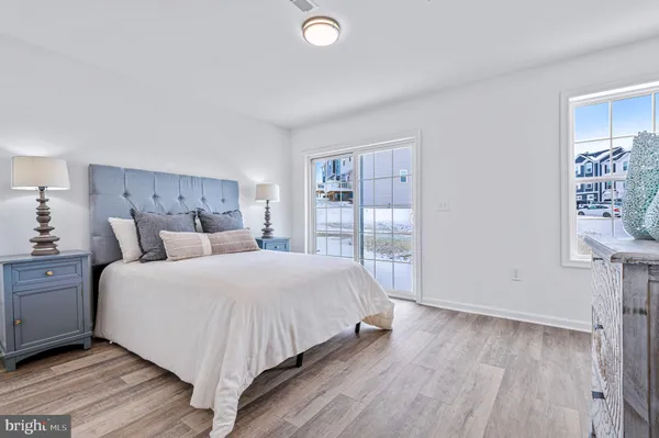 a large bedroom with a bed and a dresser