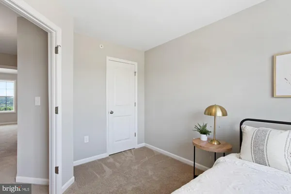 a bedroom with bed and a window