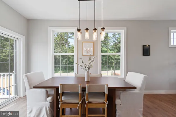a view of a dining room with furniture window and outside view