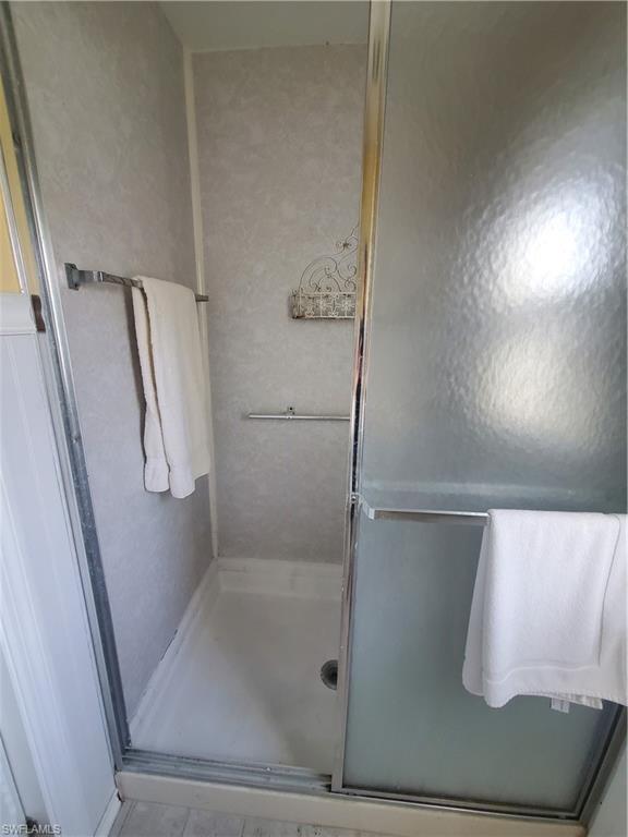 4 Topaz Lane, Unit T4 Naples, FL 34112 - Photo 13 of 17 a bathroom with a bathtub
