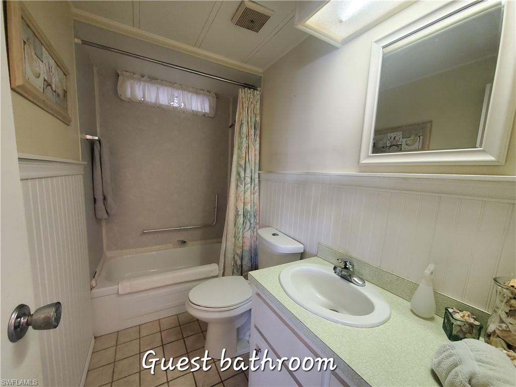 4 Topaz Lane, Unit T4 Naples, FL 34112 - Photo 16 of 17 a bathroom with a sink toilet and shower
