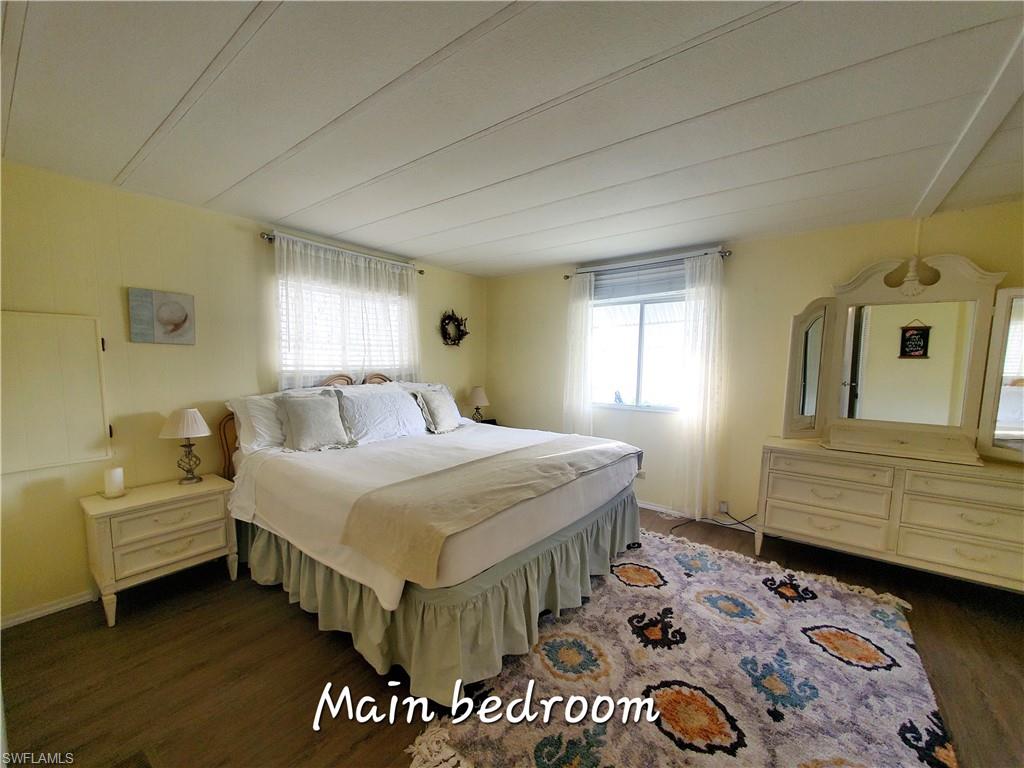 4 Topaz Lane, Unit T4 Naples, FL 34112 - Photo 8 of 17 a bedroom with a bed and window