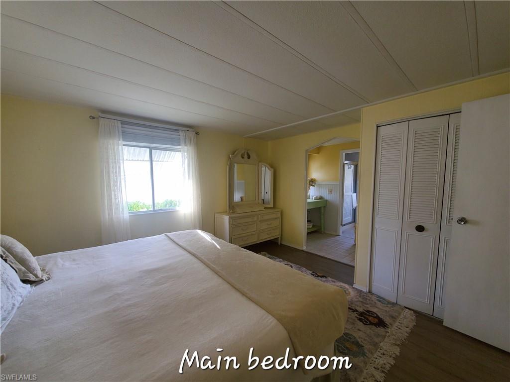 4 Topaz Lane, Unit T4 Naples, FL 34112 - Photo 10 of 17 a view of a bedroom with closet area