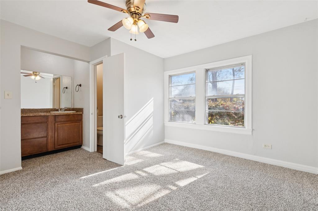 10609 Seagoville Road Dallas, TX 75217 - Photo 23 of 33 a view of a room with a kitchen and windows