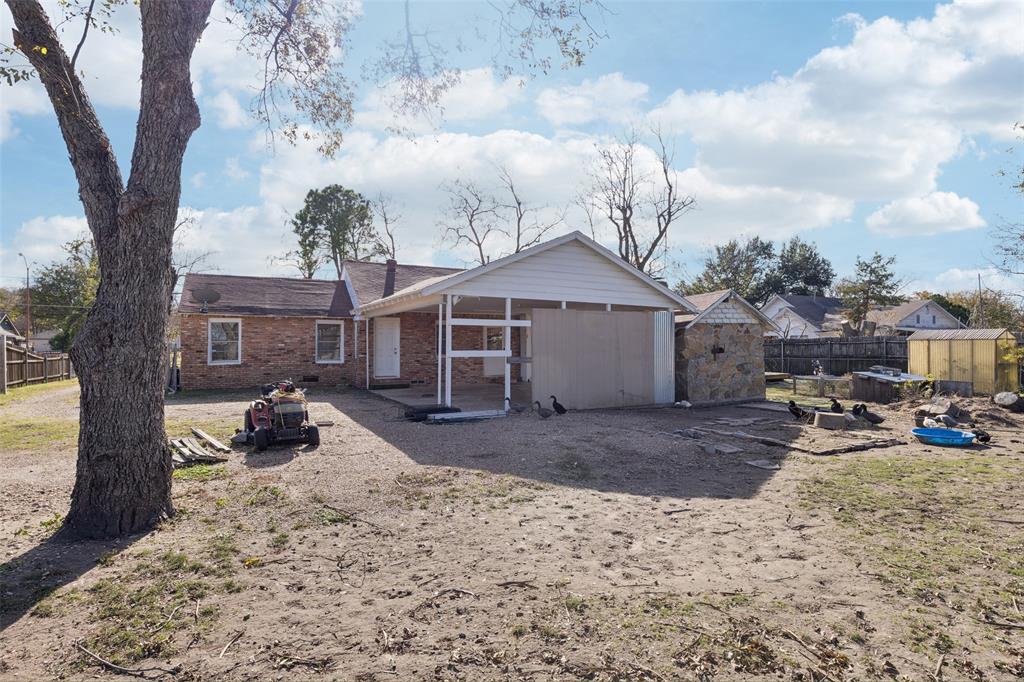 10609 Seagoville Road Dallas, TX 75217 - Photo 30 of 33 a view of a house with backyard