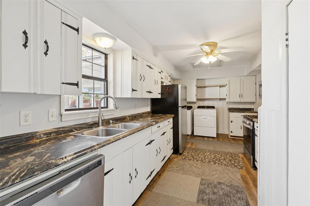 10609 Seagoville Road Dallas, TX 75217 - Photo 7 of 33 a kitchen with stainless steel appliances granite countertop a sink stove and refrigerator