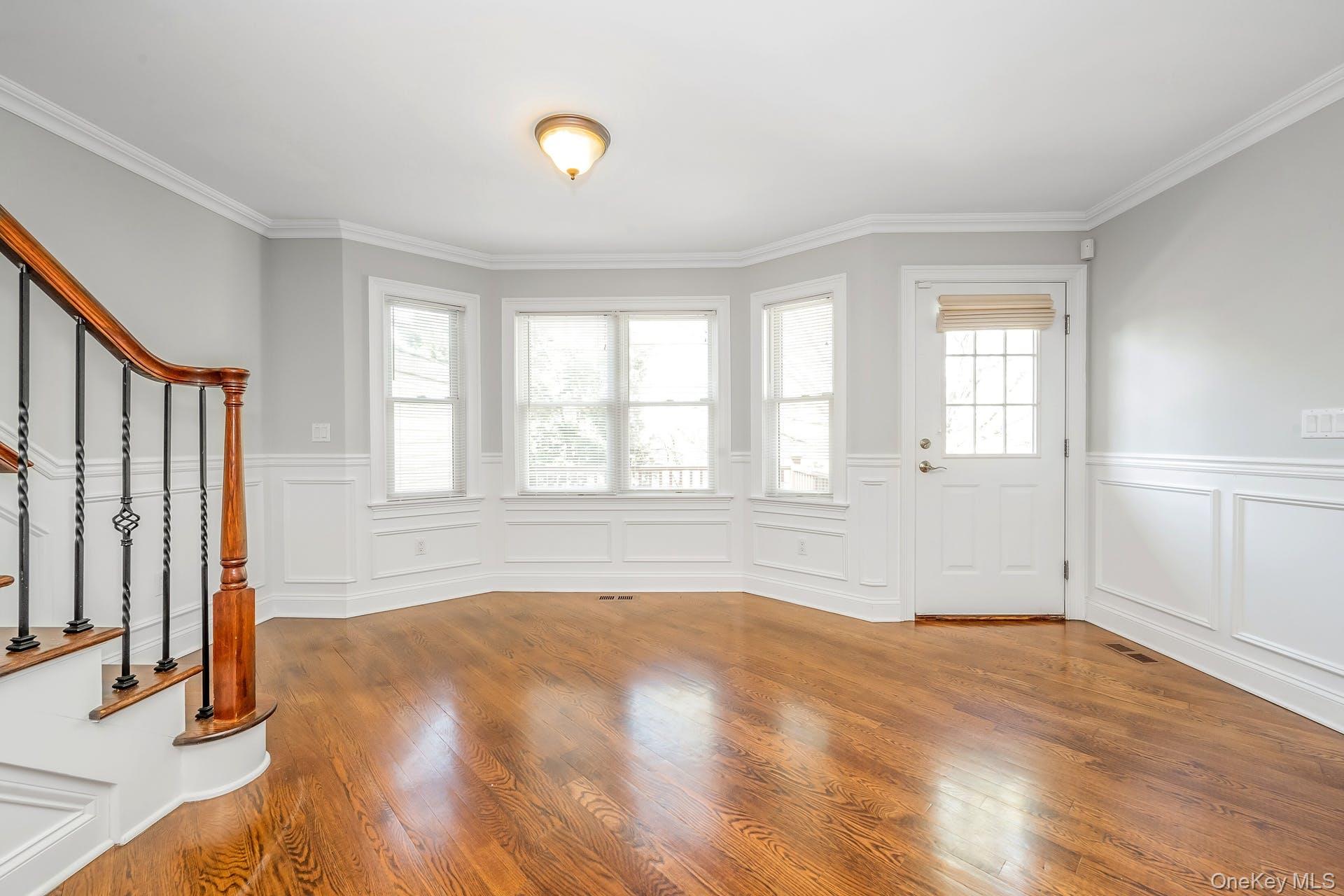 85 Park Avenue, Unit RIGHT SIDE West Harrison, NY 10604 - Photo 15 of 46 an empty room with wooden floor and windows
