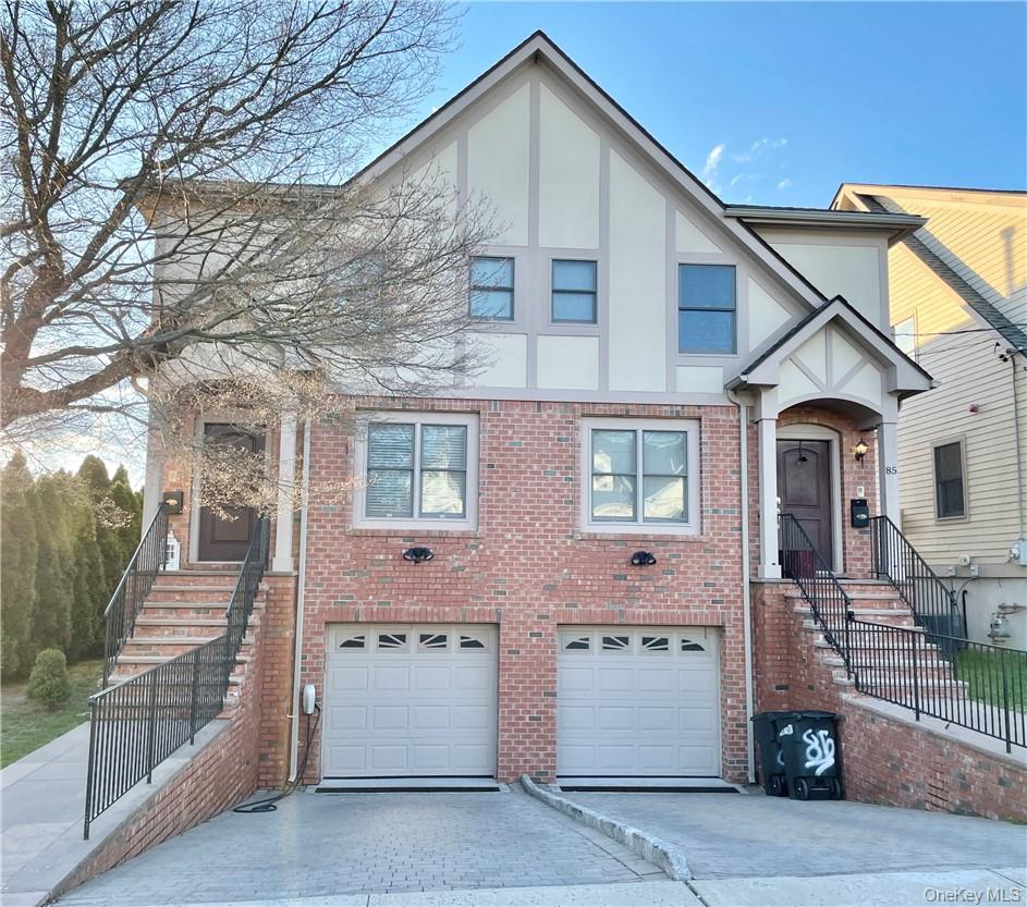 85 Park Avenue, Unit RIGHT SIDE West Harrison, NY 10604 - Photo 2 of 46 a front view of a house with a garage