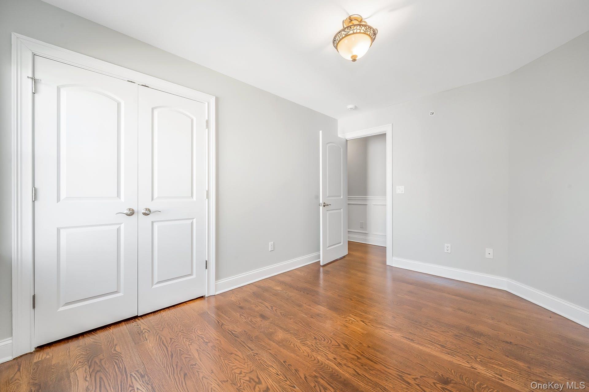 85 Park Avenue, Unit RIGHT SIDE West Harrison, NY 10604 - Photo 25 of 46 wooden floor in an empty room with a window