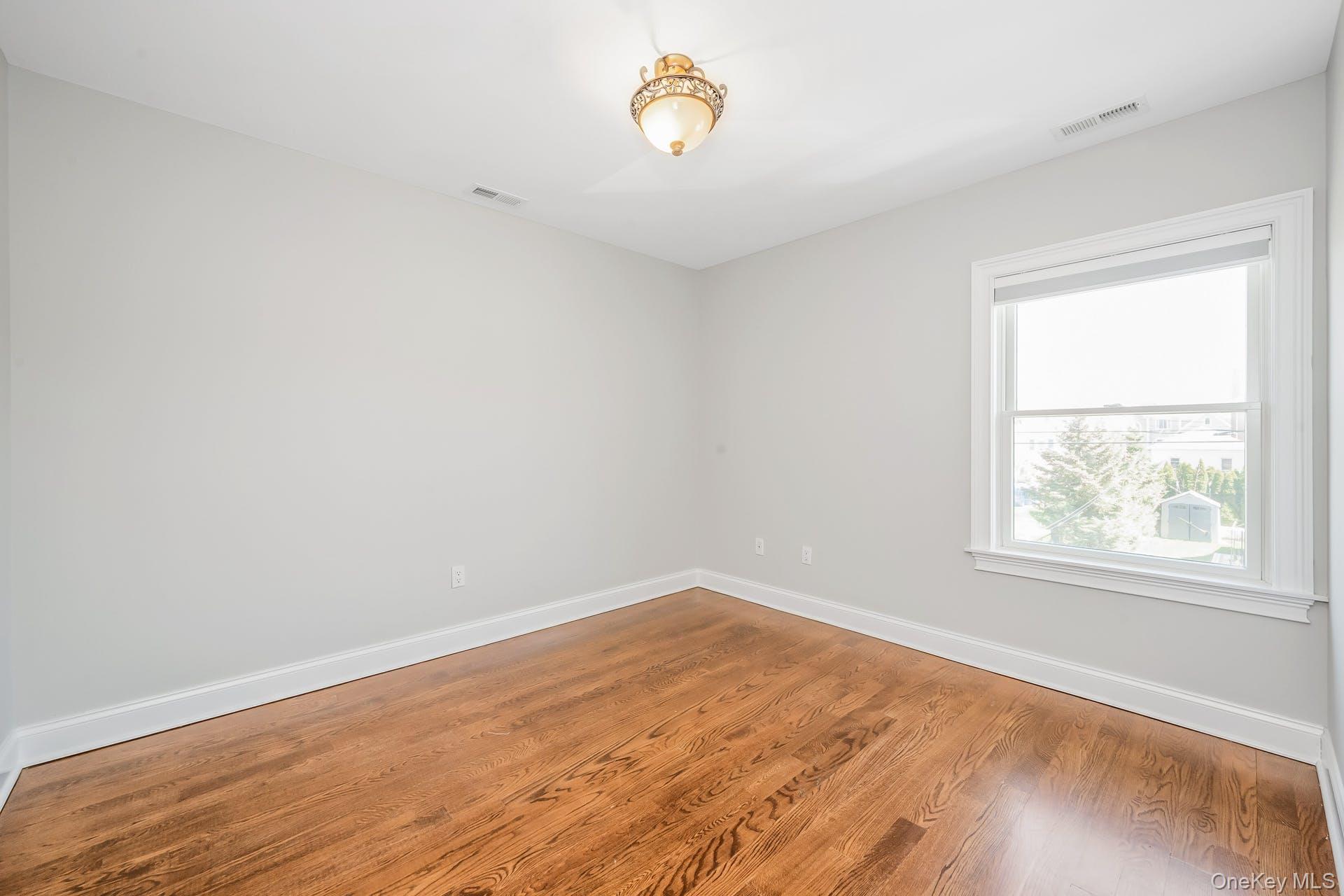 85 Park Avenue, Unit RIGHT SIDE West Harrison, NY 10604 - Photo 27 of 46 an empty room with a window