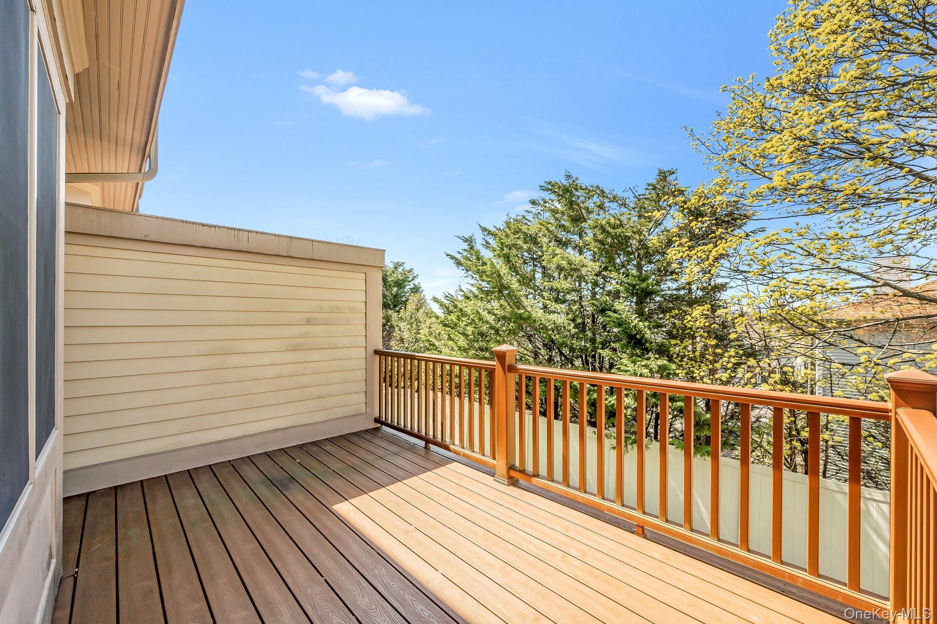 85 Park Avenue, Unit RIGHT SIDE West Harrison, NY 10604 - Photo 35 of 46 a view of a wooden balcony with an outdoor space
