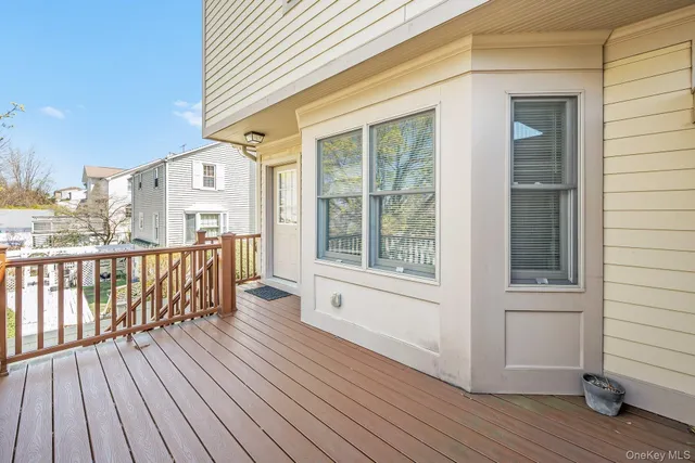 a view of a house with a yard and sitting area
