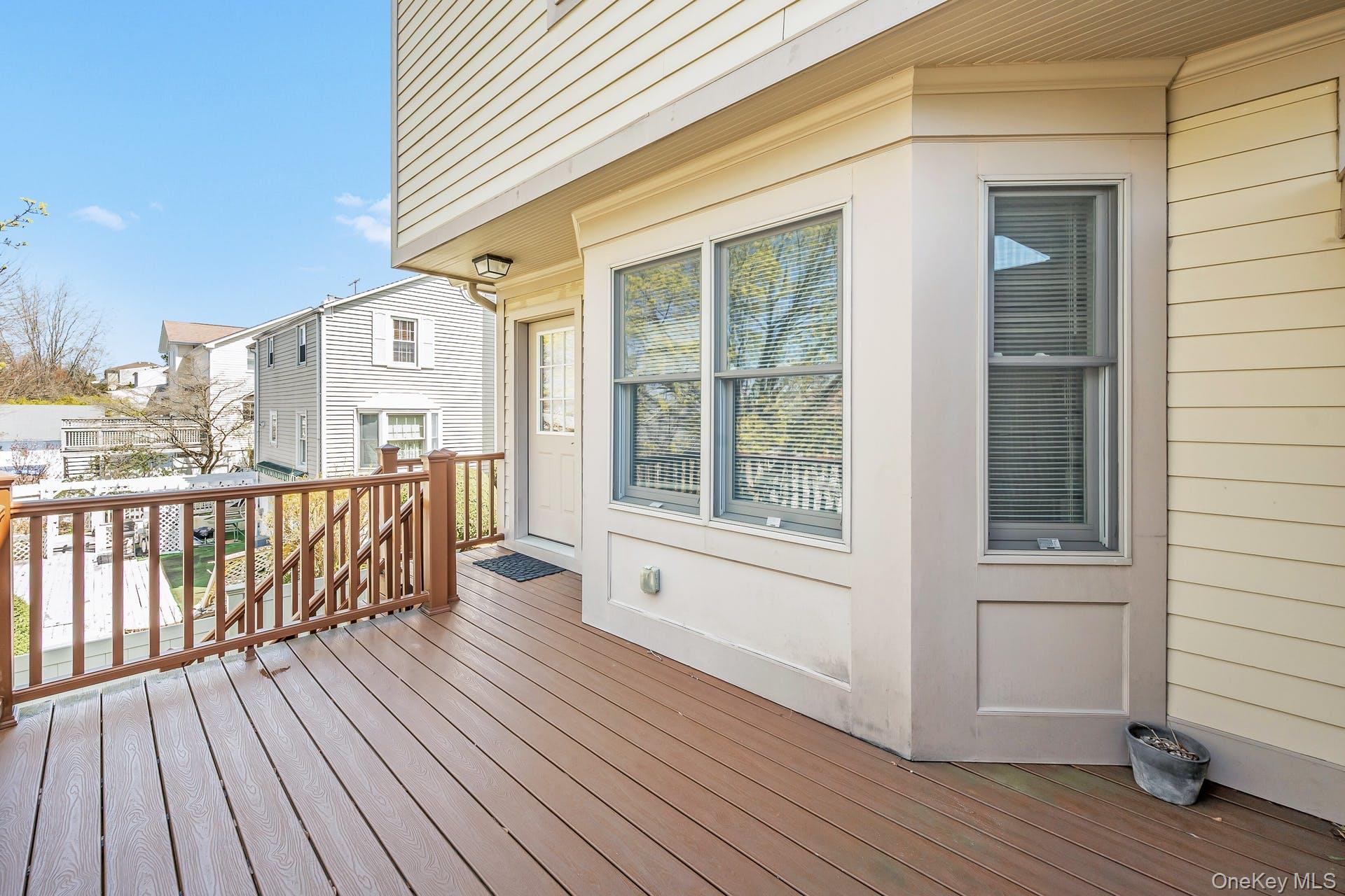 85 Park Avenue, Unit RIGHT SIDE West Harrison, NY 10604 - Photo 38 of 46 a view of a balcony with wooden floor