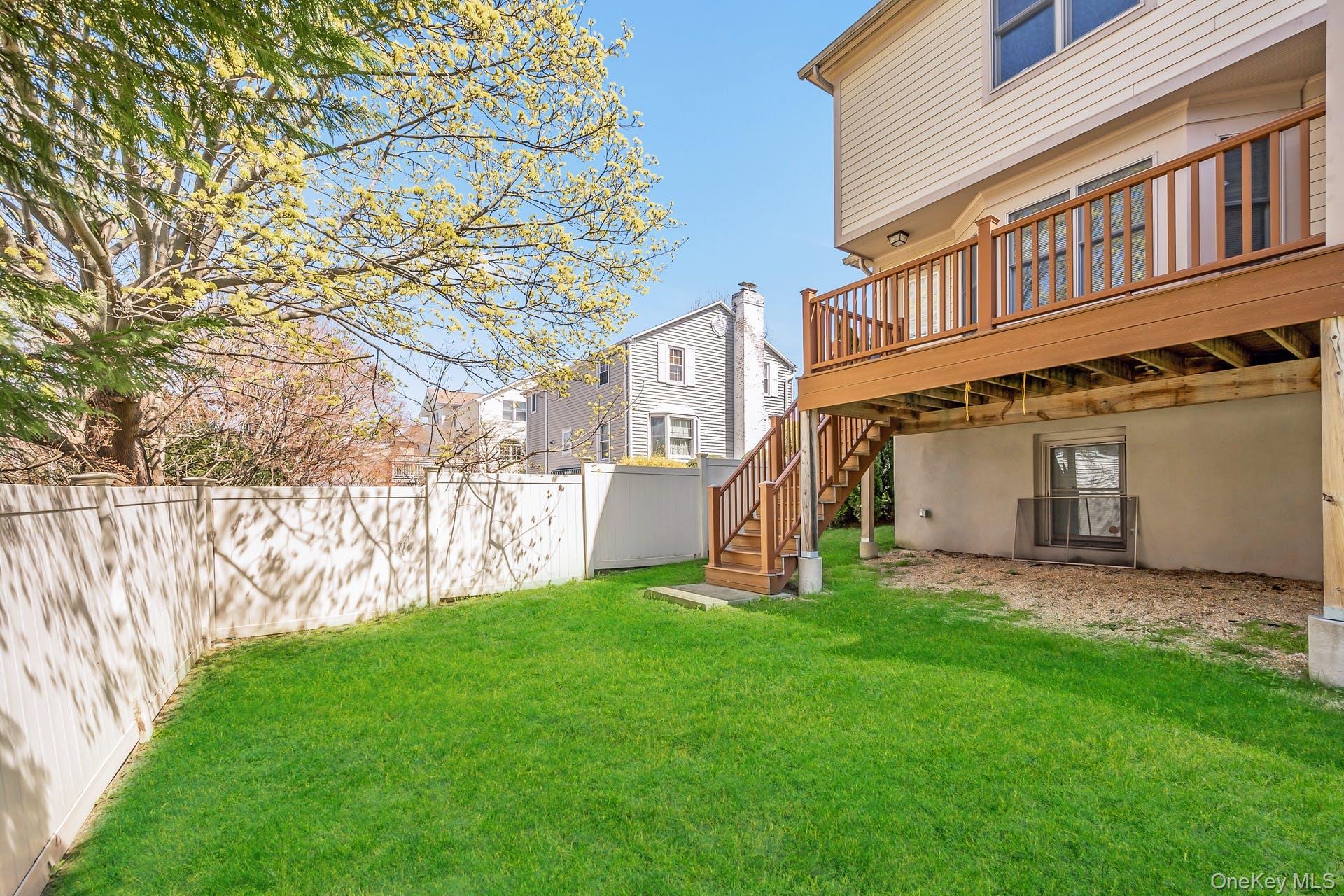 85 Park Avenue, Unit RIGHT SIDE West Harrison, NY 10604 - Photo 39 of 46 a view of a house with a yard and sitting area