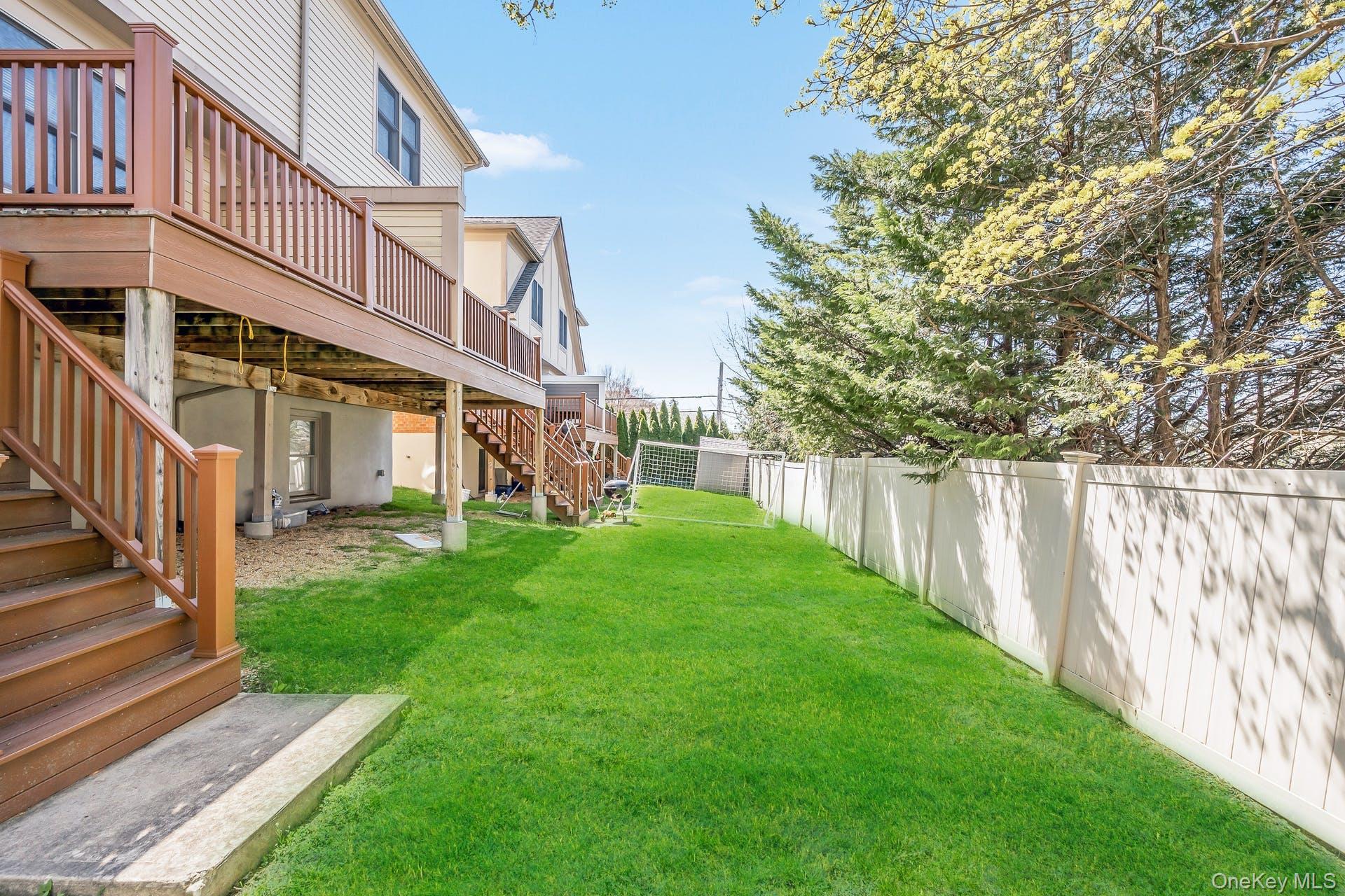 85 Park Avenue, Unit RIGHT SIDE West Harrison, NY 10604 - Photo 40 of 46 a view of a house with a yard and deck