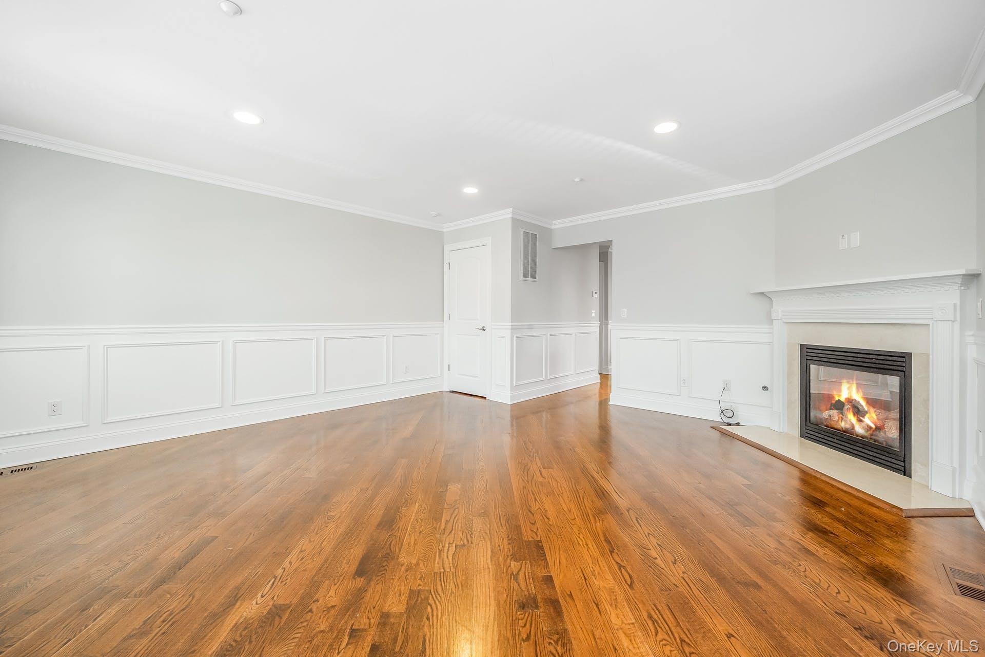 85 Park Avenue, Unit RIGHT SIDE West Harrison, NY 10604 - Photo 5 of 46 wooden floor in an empty room with a window