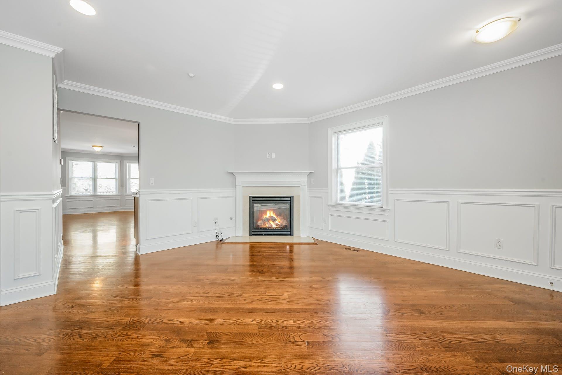 85 Park Avenue, Unit RIGHT SIDE West Harrison, NY 10604 - Photo 8 of 46 a view of an empty room with window and wooden floor