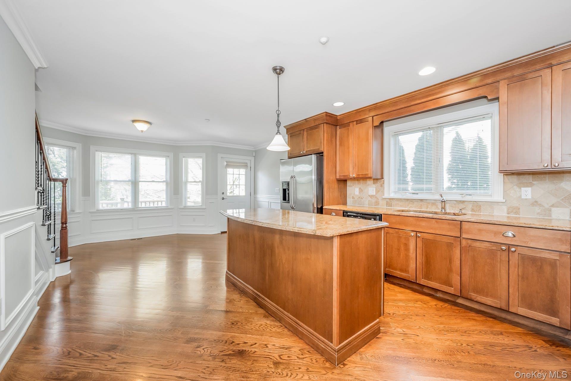 85 Park Avenue, Unit RIGHT SIDE West Harrison, NY 10604 - Photo 9 of 46 a large kitchen with kitchen island granite countertop a stove a sink and a large window