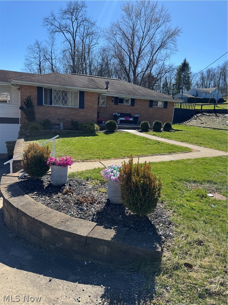 929 May Road East Liverpool, OH 43920 - Photo 2 of 41 Single story home with a front lawn and brick siding