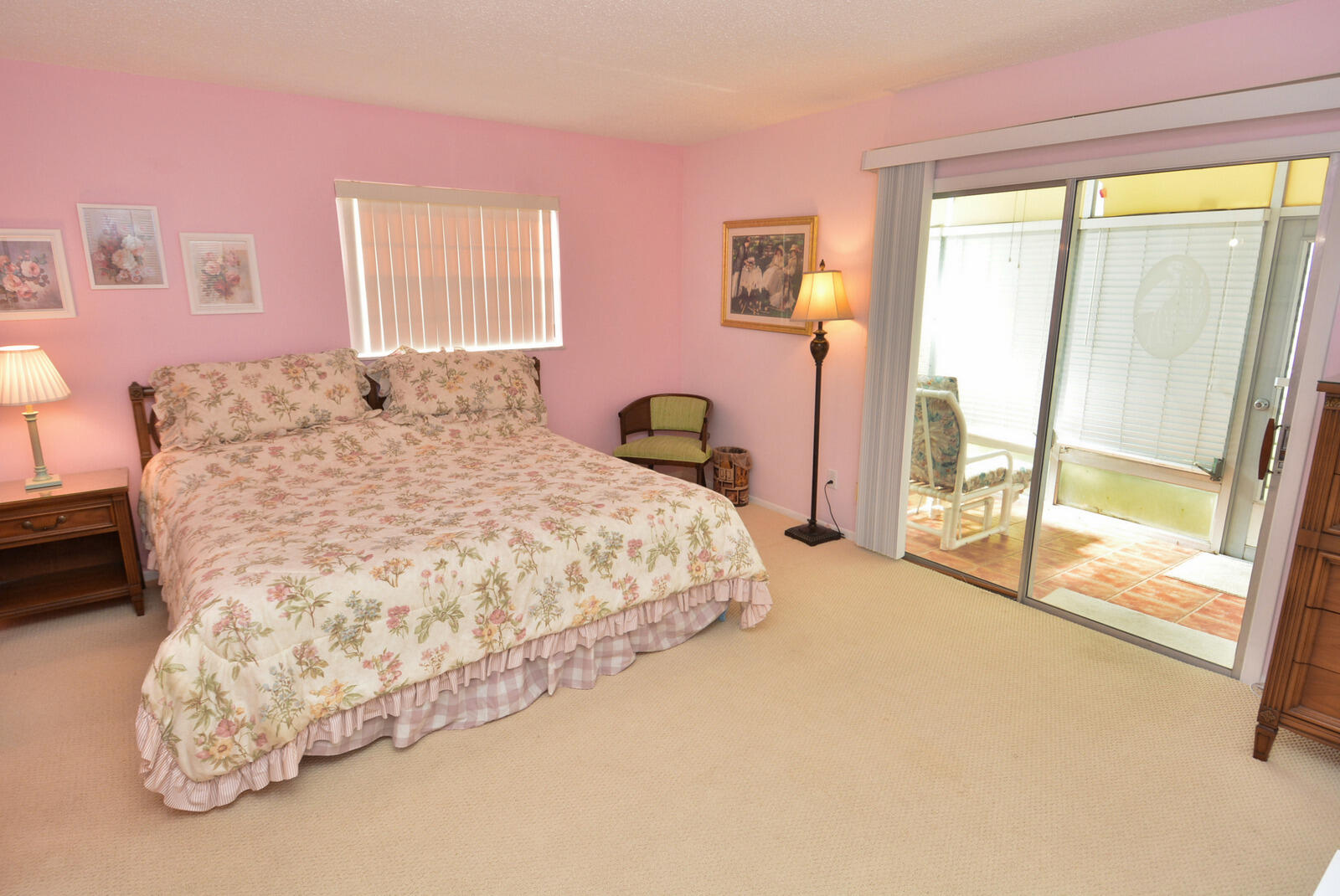 1225 Northwest 21st Street, Unit 2003 Stuart, FL 34994 - Photo 13 of 30 a bedroom with a bed and a large window