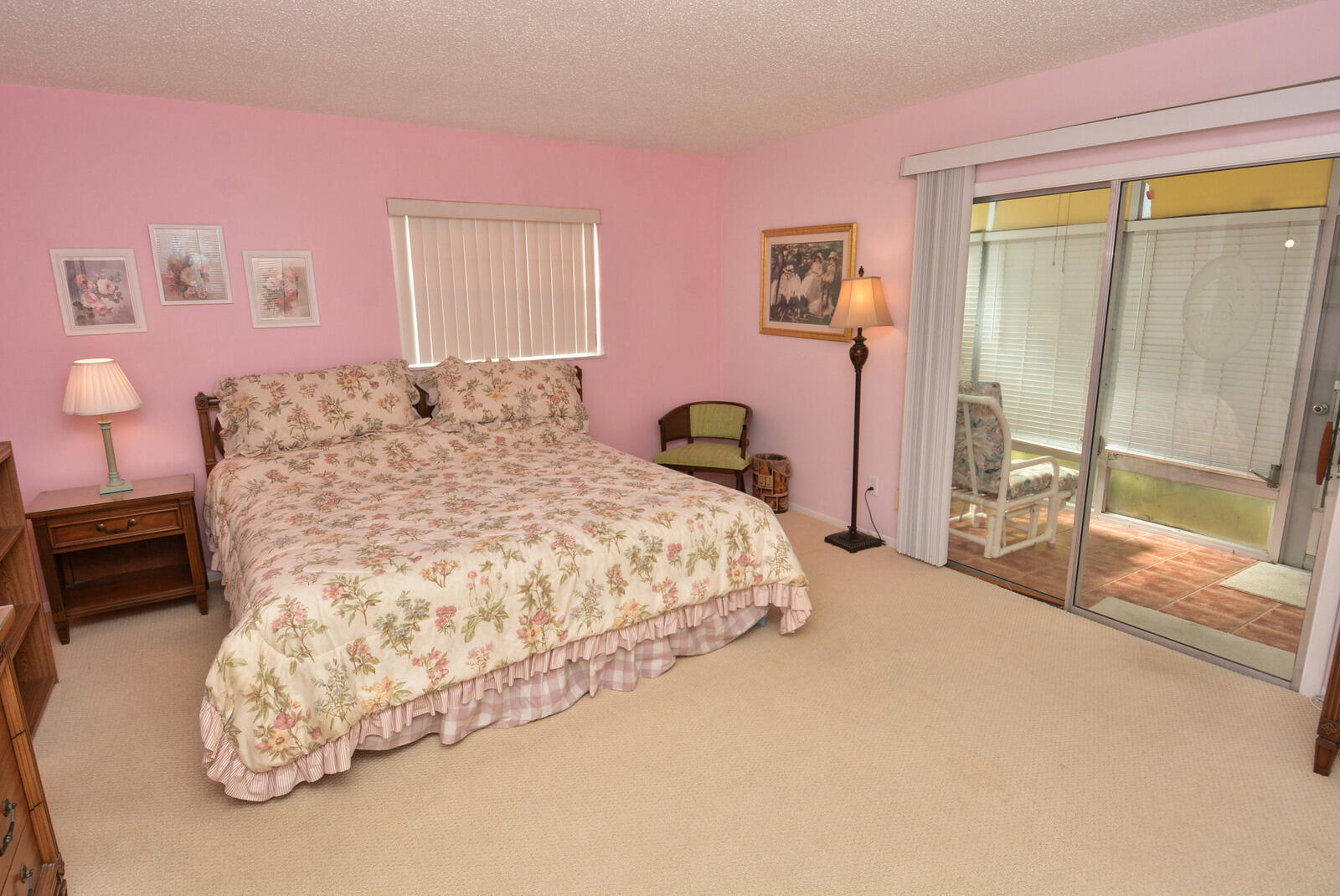 1225 Northwest 21st Street, Unit 2003 Stuart, FL 34994 - Photo 14 of 30 a bedroom with a bed and a large window