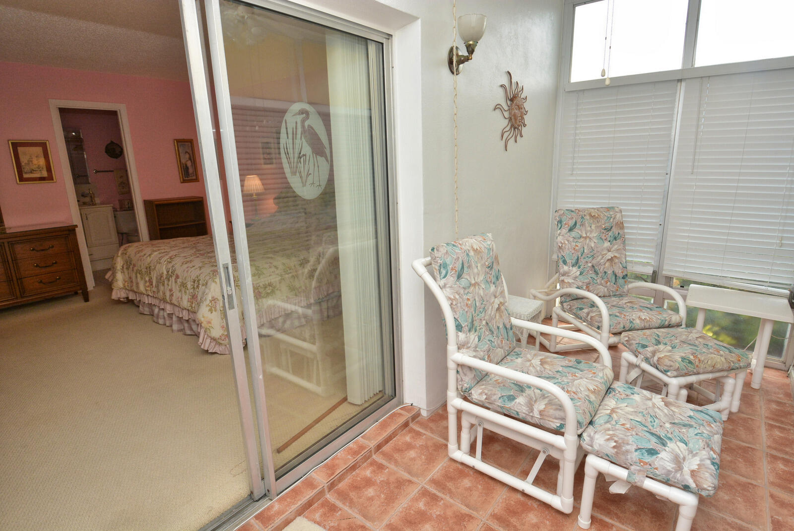 1225 Northwest 21st Street, Unit 2003 Stuart, FL 34994 - Photo 20 of 30 a bedroom with a bed and a mirror