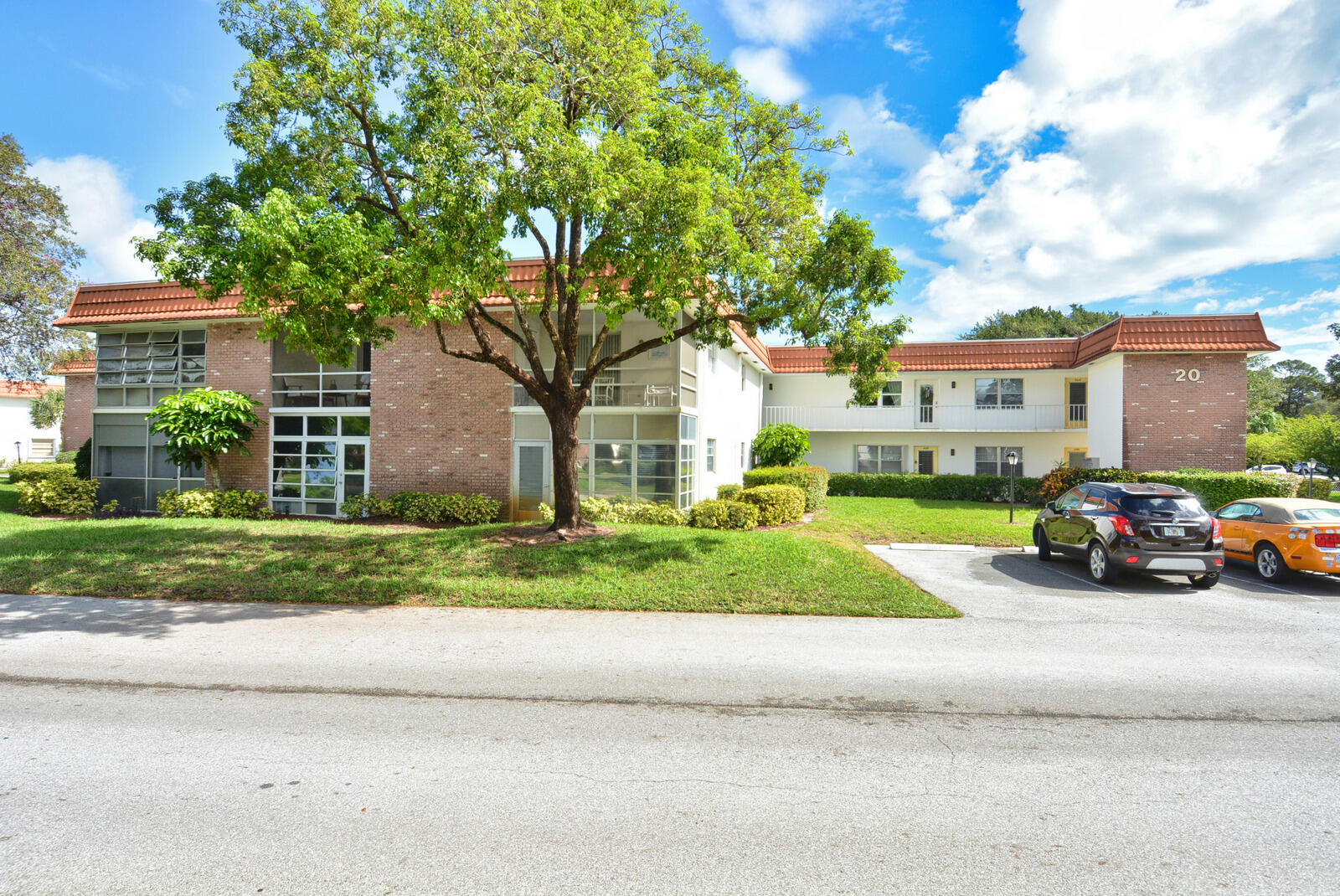 1225 Northwest 21st Street, Unit 2003 Stuart, FL 34994 - Photo 22 of 30 a view of street with parked cars