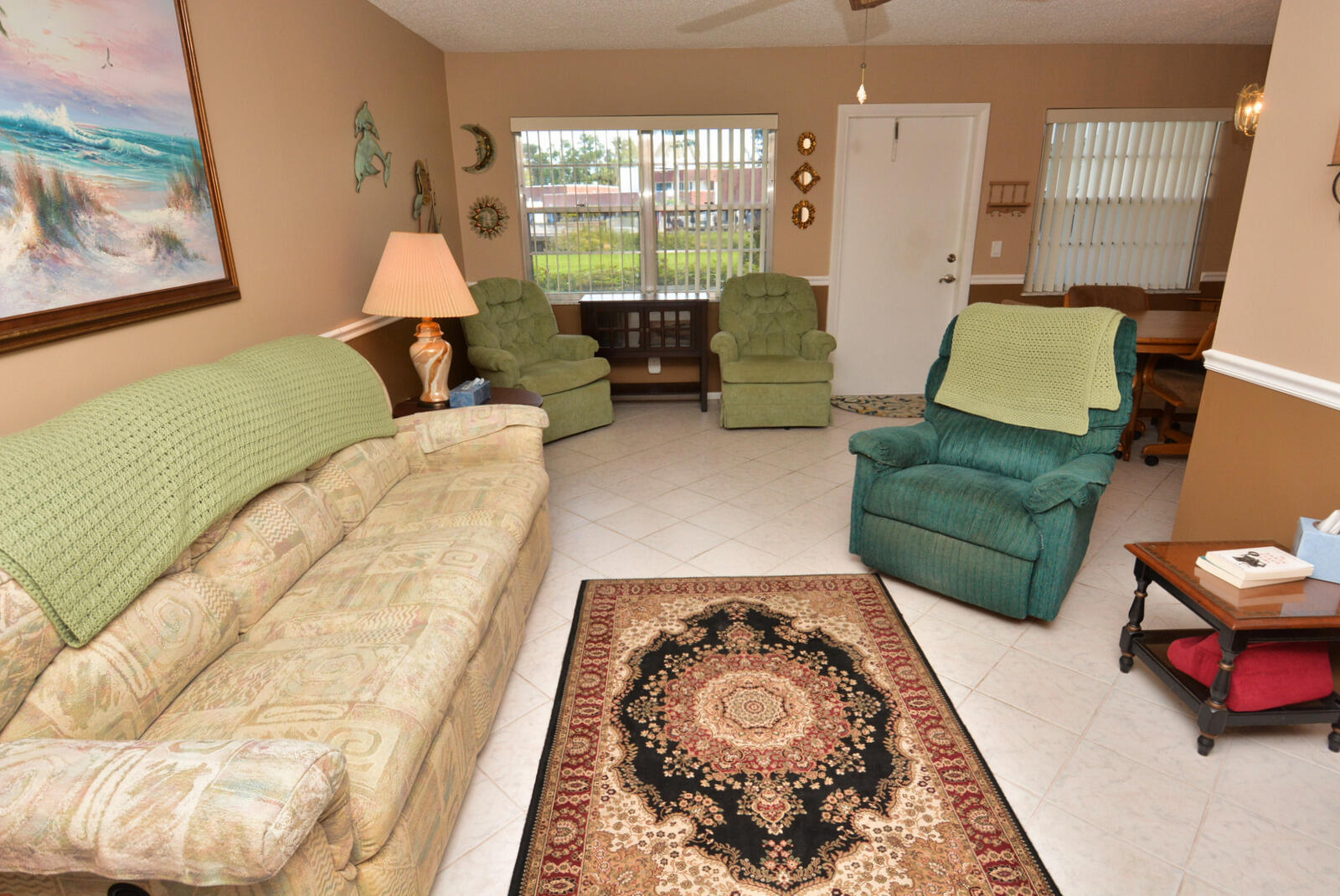 1225 Northwest 21st Street, Unit 2003 Stuart, FL 34994 - Photo 8 of 30 a living room with furniture and a large window