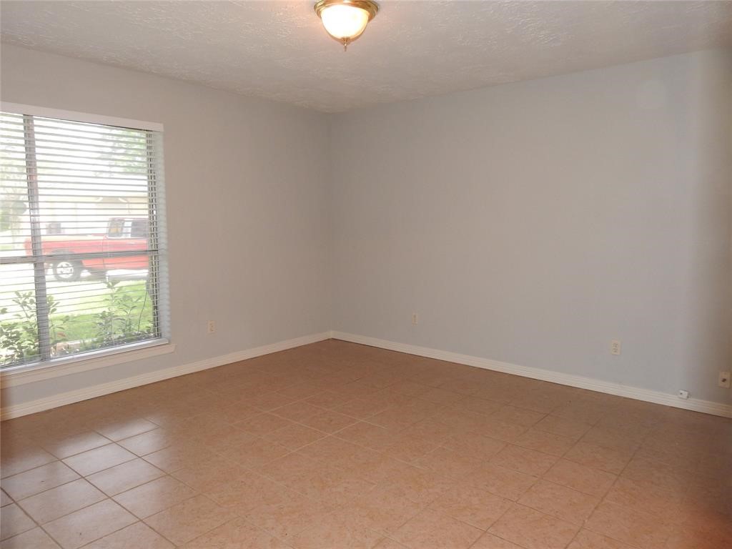 19902 Bishops Gate Lane Humble, TX 77338 - Photo 12 of 15 an empty room with a window