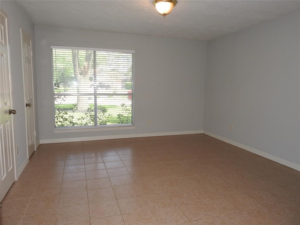 19902 Bishops Gate Lane Humble, TX 77338 - Photo 13 of 15 an empty room with a window