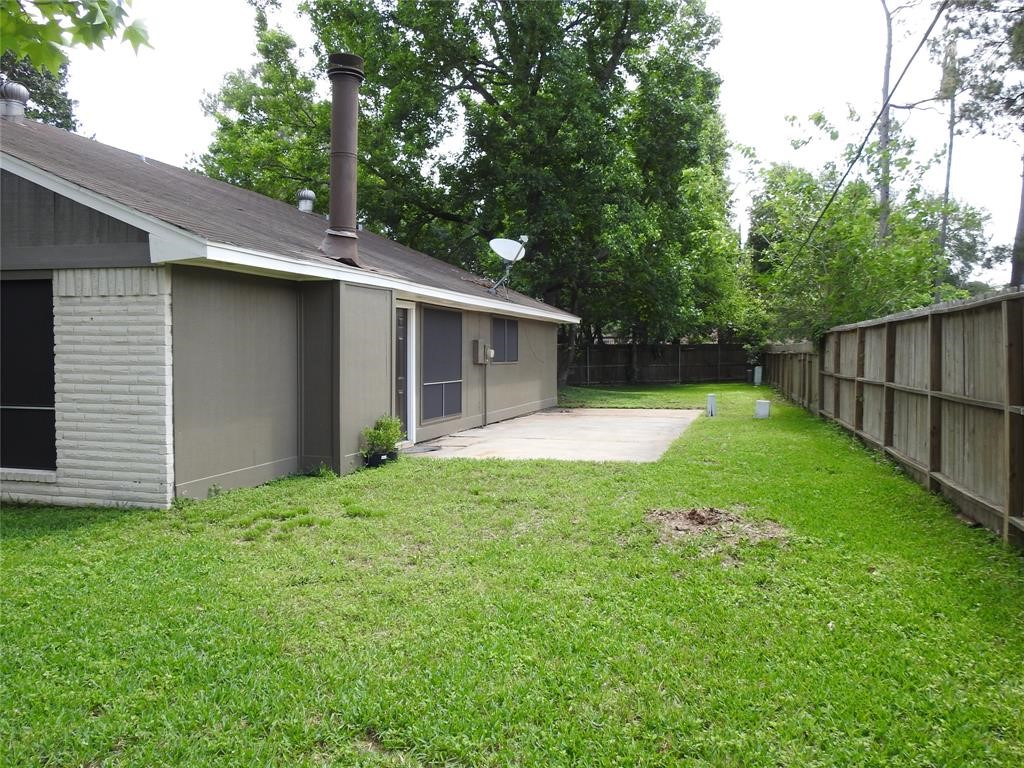 19902 Bishops Gate Lane Humble, TX 77338 - Photo 14 of 15 a view of a house with backyard and garden