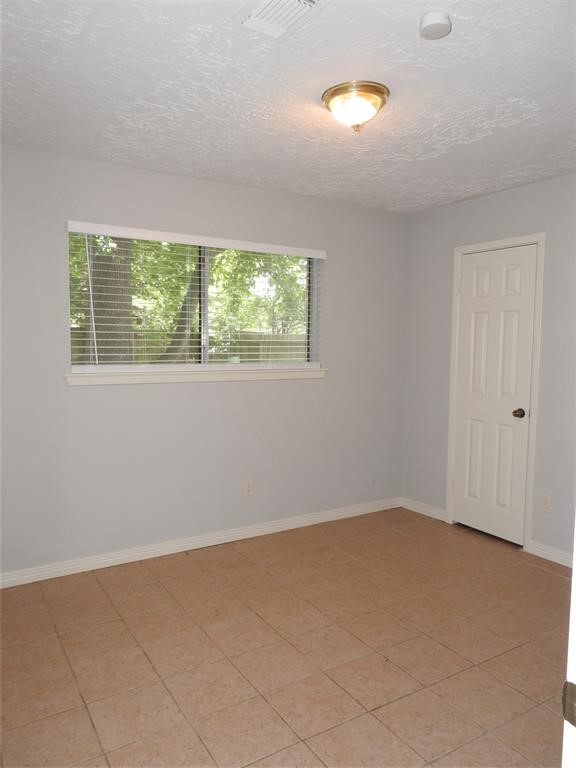 19902 Bishops Gate Lane Humble, TX 77338 - Photo 6 of 15 an empty room with windows