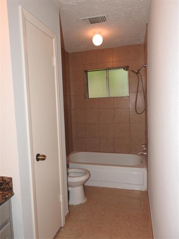 19902 Bishops Gate Lane Humble, TX 77338 - Photo 10 of 15 a bathroom with a toilet and a shower
