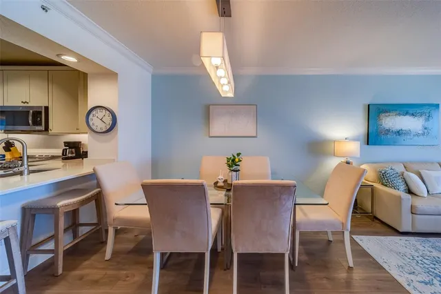 a spacious bedroom with a bed and a flat screen television