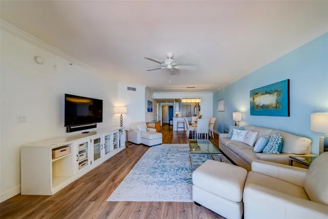 a bedroom with a bed tv and a window